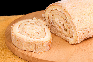 Cake roll on kitchen board