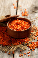 Red lentils on a grey wooden table