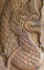 Antique sculpture of dragon on wood