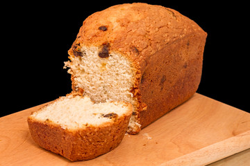 Muffins with raisins on kitchen board