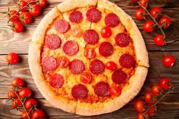 Pepperoni pizza and tomato