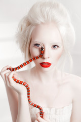 albino white woman with red lips and red snake beauty
