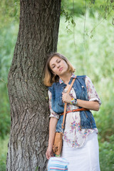 Young beautiful girl on a walk in the country