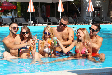 Young people having fun in the swimming pool