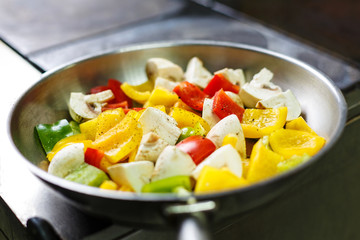 Pan with vegetables on a stove