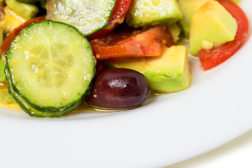 Fresh avocado salad with olives.