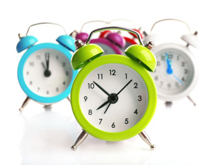 A group of alarm clocks, isolated on white