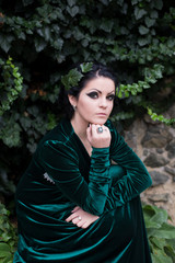 Unusual beautiful bride in a green dress