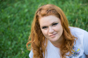 Fototapeta premium Young beautiful girl on a walk in the country