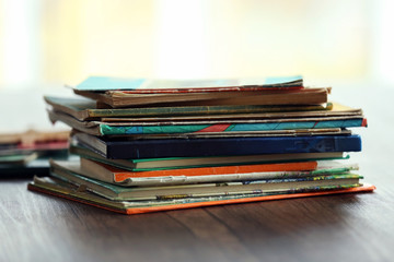 Pile of old books on wooden table
