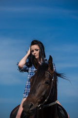 Obraz premium Young beautiful girl with a horse on nature