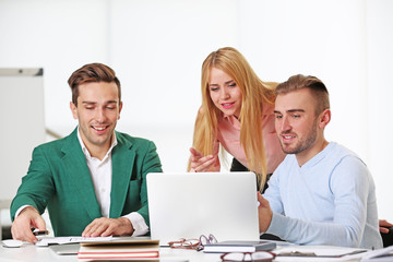 Young business people discussing a new project at the meeting in a conference room