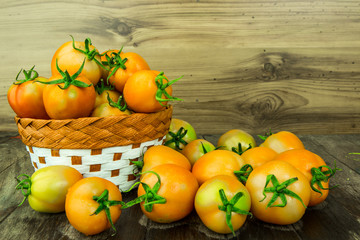 group of tomatoes on wooden background