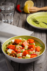 Chickpea salad with pumpkin, feta, parsley and chili. Healthy food. Selective focus.