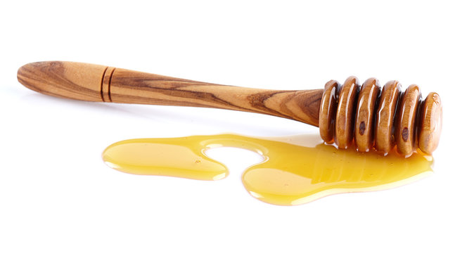 Sweet honey with wooden spoon