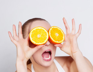 Girl with fresh orange