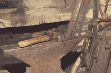 Hammer and anvil, detail of a forge, metal tools