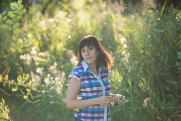 Young beautiful girl on a walk in the country