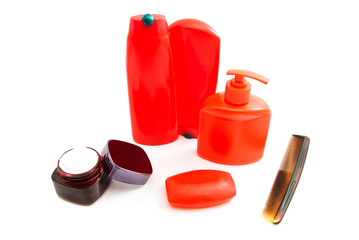 Obraz premium hairbrush, red soap and other toiletry