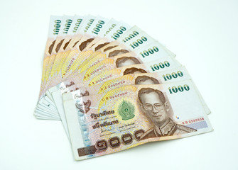 Pile of Thai money on white