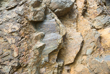Rock texture and surface background. Cracked and weathered natural stone background.