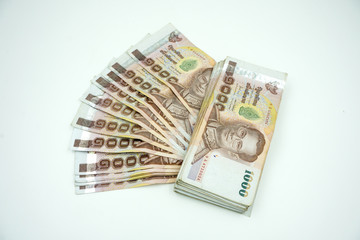 Pile of Thai money on white