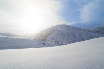 Fototapeta na wymiar beautiful snow mountain at dawn sun