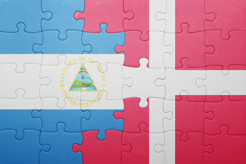 puzzle with the national flag of nicaragua and denmark