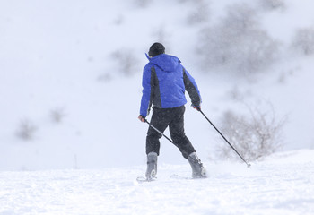 Fototapeta na wymiar people skiing in the snow in the winter