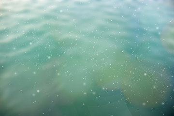 Beautiful bokeh made of blurred lights on blue background, Abstract defocused colorful blurred background.