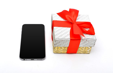 Gift box with red ribbon and smartphone isolated