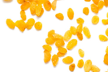 Golden raisins on a white background
