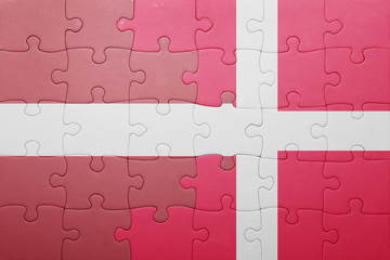 puzzle with the national flag of latvia and denmark