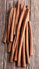 Cinnamon sticks on a wooden background