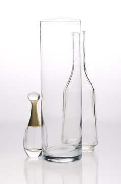Glass, carafe and bottle the spirits on a gray white background
