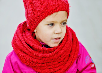  girl wearing red scarf and hat