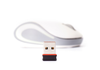 Wireless computer mouse with small radio receiver on white backg
