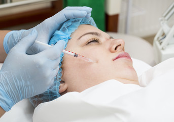 Fototapeta premium Cosmetic treatment with injection in a clinic