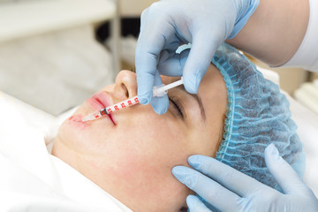 Cosmetic treatment with injection in a clinic