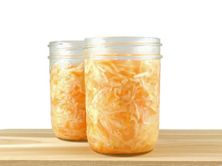 Two glass jars with sauerkraut