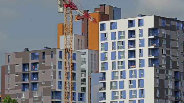 A crane tower outside the building in Milan Italy. A crane tower used to carry heavy loads during comstruction