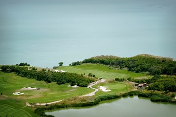 Fototapeta na wymiar Golf Field Over Water