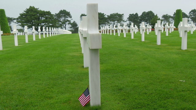 Side views of the white cross in the Normandy cemetery. The Normandy American Cemetery and Memorial is a World War II cemetery and memorial in Colleville-sur-Mer Normandy France 
