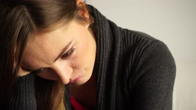 Woman face sad and stressed closeup 4K