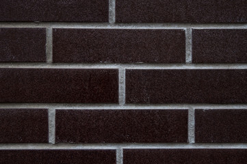 Black tiles imitating brick. Texture