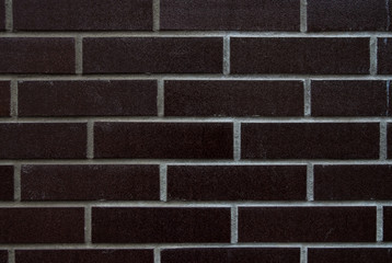 Black tiles imitating brick. Texture