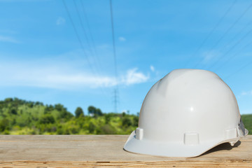 Safety helmet with over Construction site background