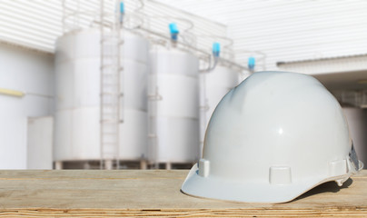 Safety helmet with over Construction site background