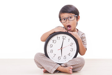 Cute boy is holding big clock 