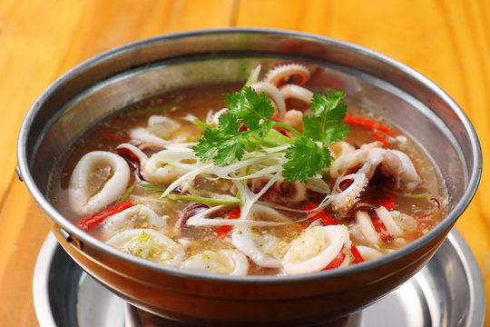 spicy squid soup in metal dish